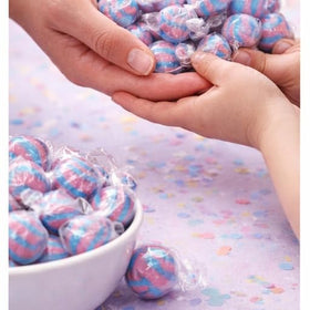 Bright pink-blue cotton candy balls showcased for colorful buffets