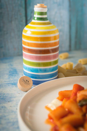 Muraglia Antico Frantoio EVOO rainbow bottle side view showcases craftsmanship