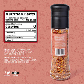 MY SECRETS PEGGY'S FOOD Crazy Salt shaker on table demonstrates versatile finishing salt for grilled dishes.