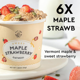Close-up of ingredients in Mylk Labs Maple Strawberry Oatmeal Cup with oats and fruit