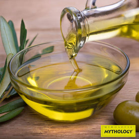 Mythology olive oil bottle on kitchen counter for everyday cooking.