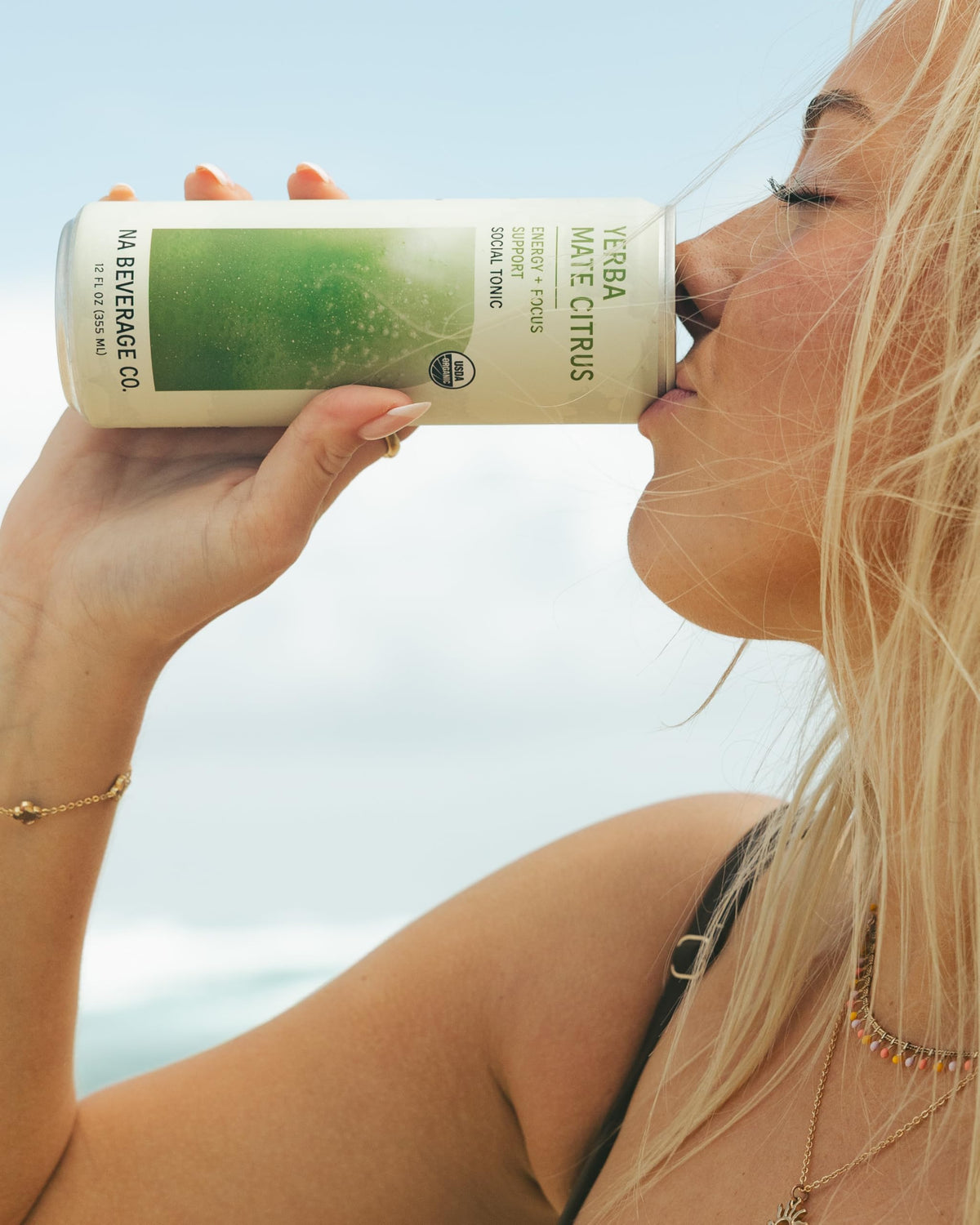 Bottle and glass of NA Beverage Social Tonic with clean label look