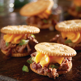 Serving plate with Ritz crackers and Easy Cheese ready to dip.