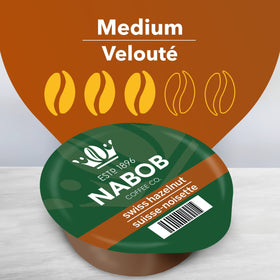 NABOB Tassimo Swiss Hazelnut coffee disc brew closeup emphasizing aroma and clarity