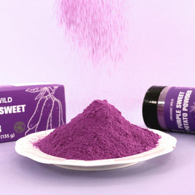 Nacolorce purple powder pours into smoothie to add color and mild sweetness.