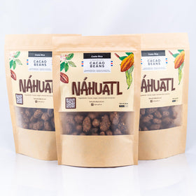 NAHUATL organic cacao beans on wood surface ready to snack.