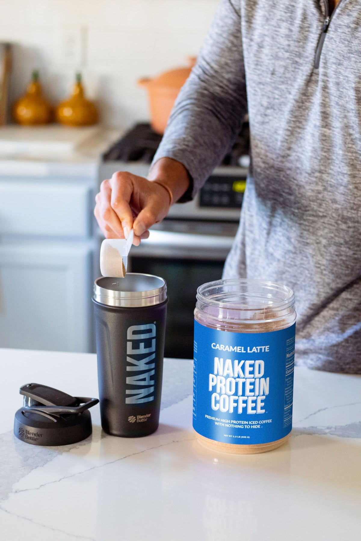 NAKED Caramel Latte Protein Coffee in gym bag, ready-made energy for on-the-go.