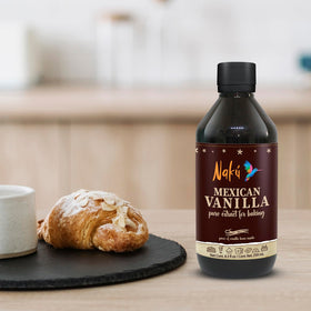 Naku vanilla extract poured over dessert batter showing aroma