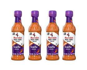 Nando's PERi PERi Garlic Sauce bottle front for bold flavor.