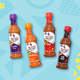 Nando's Garlic Sauce bottle ready to season meats and vegetables.