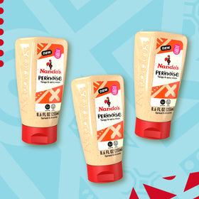 Nando's PERinaise ingredients closeup, fresh chilies and garlic for bold flavor.