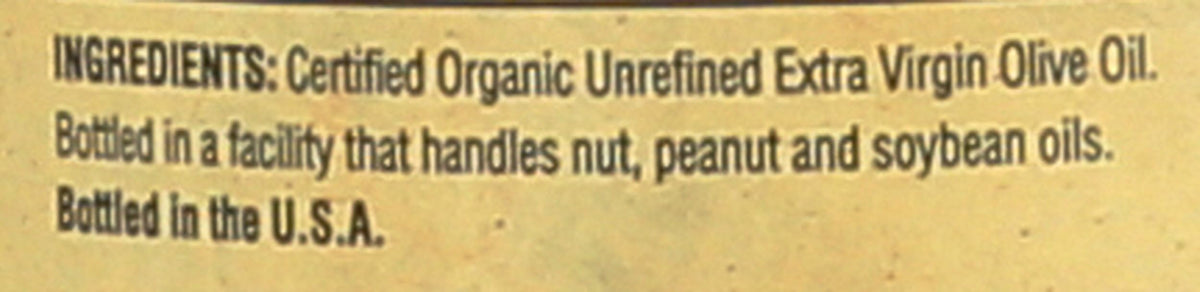 Napa Valley Naturals Organic EVOO unfiltered, rich texture in glass bottle.