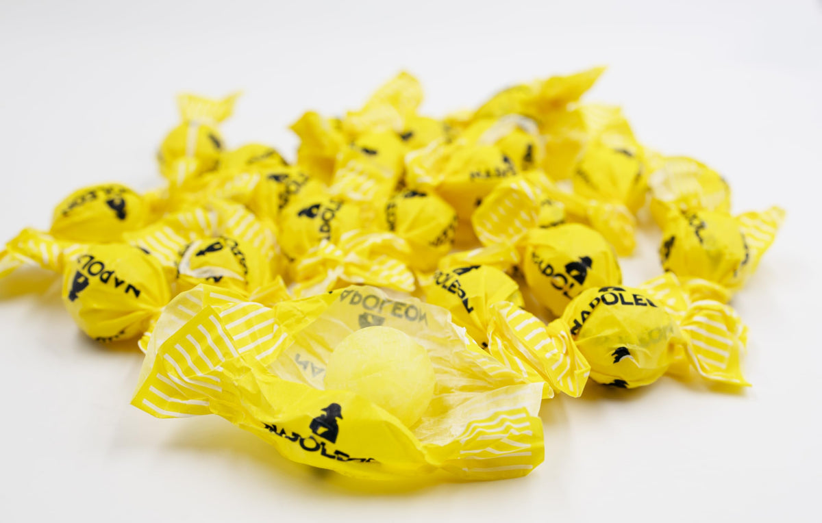 Napoleon Candy Lemon Balls hard candy with bright yellow shell