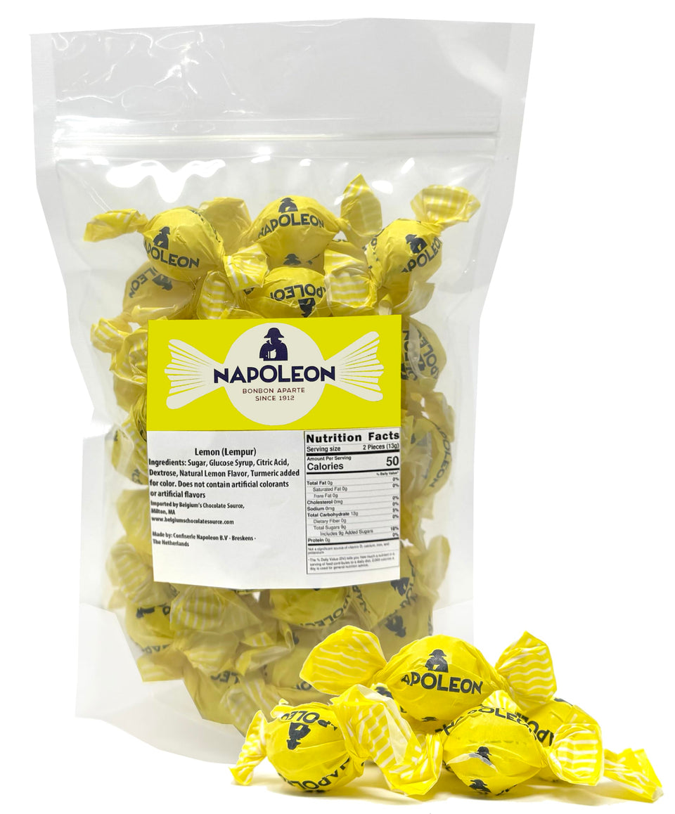 Napoleon Sour Lemon Balls close-up showing glossy shell and powder center for bold, long-lasting flavor.