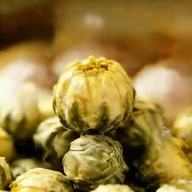 NASLAPH Chrysanthemum Tea fields bathed in sunlight signal natural quality.
