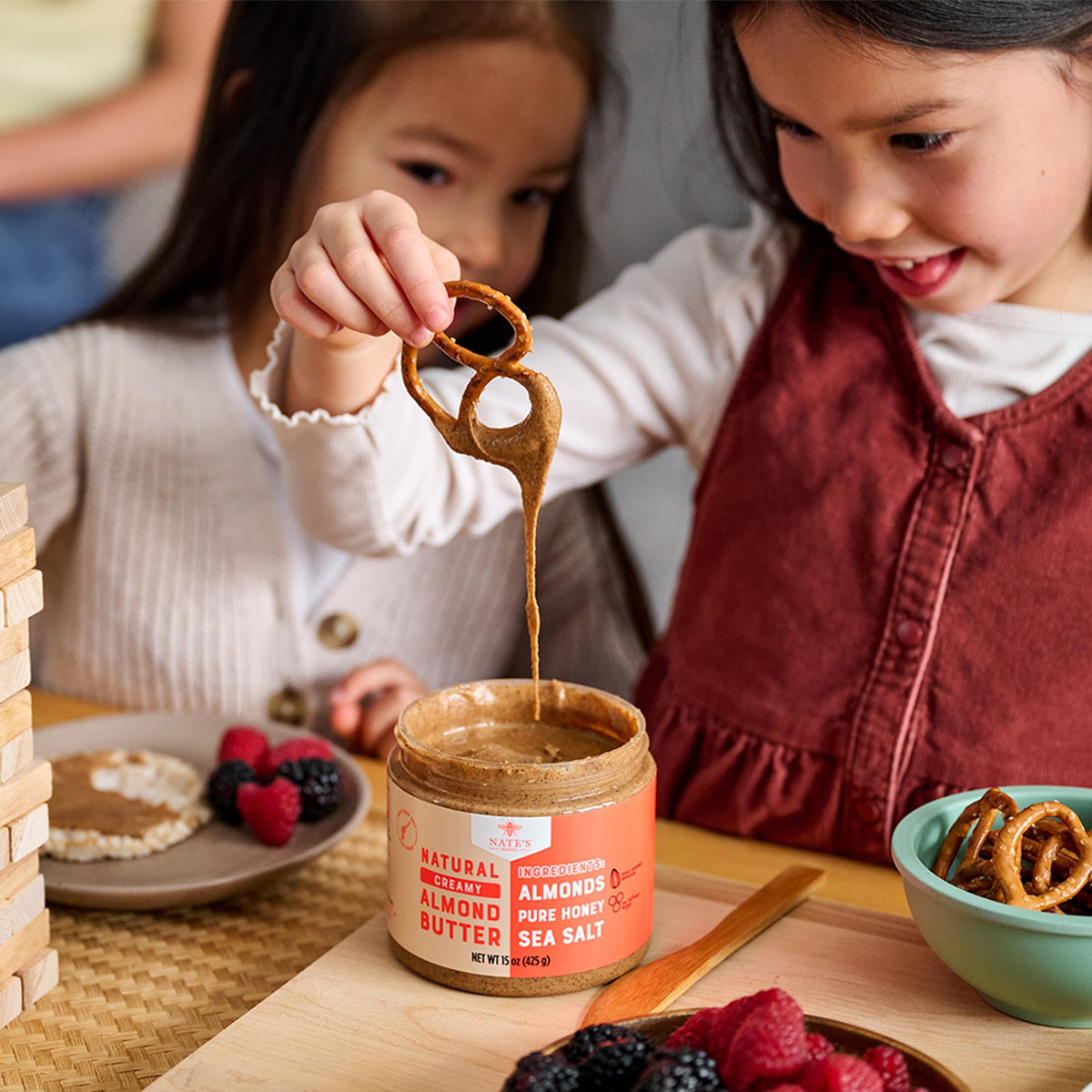 Nate's Honey Almond Butter paired with fruit spread for a quick, balanced treat.