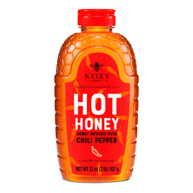Nate's Honey Hot Honey 32oz bottle pour boosts sauces with sweet heat.