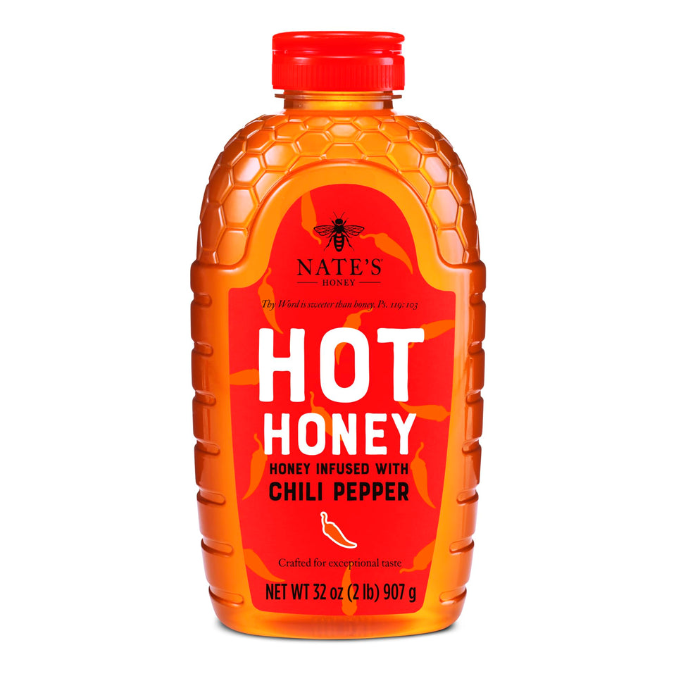 Nate's Honey Hot Honey 32oz bottle pour boosts sauces with sweet heat.