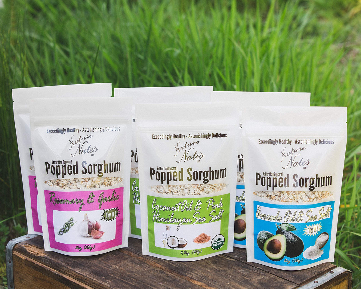 Nature Nate’s popped sorghum coconut oil pink Himalayan sea salt with golden kernels.