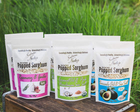 Nature Nate’s popped sorghum coconut oil pink Himalayan sea salt with golden kernels.