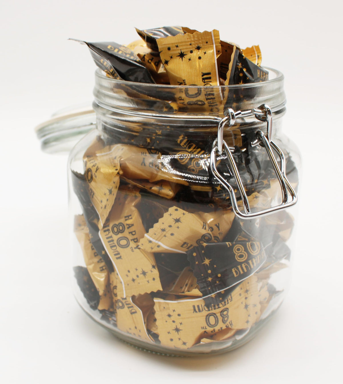 Naturejam 80th birthday favors ready for guests, adding a festive touch.