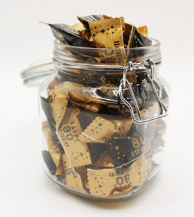 Naturejam 80th birthday favors ready for guests, adding a festive touch.
