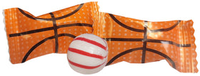 Naturejam basketball peppermint candy displayed in white rounds with rose gold wrappers for party decor.
