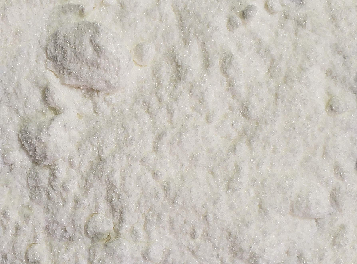 Naturejam Vanillin Powder aroma close-up, ideal for enhancing beverages and pastries.