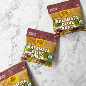 Charcuterie board with Nature's Greatest Foods Kalamata olives for entertaining