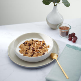 Bowl of Nature's Path Flax Plus Raisin Bran with milk.