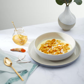 Close-up of Nature's Path Golden Turmeric Cereal crunchy flakes with spices.
