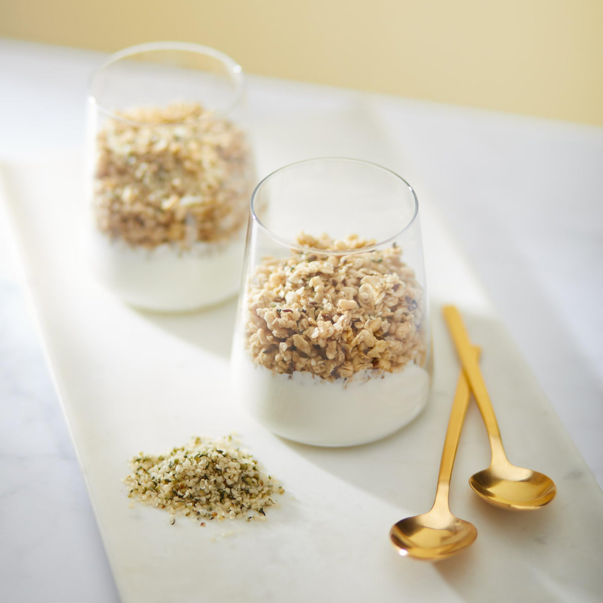 Granola pouring into a bowl, ready to enjoy.