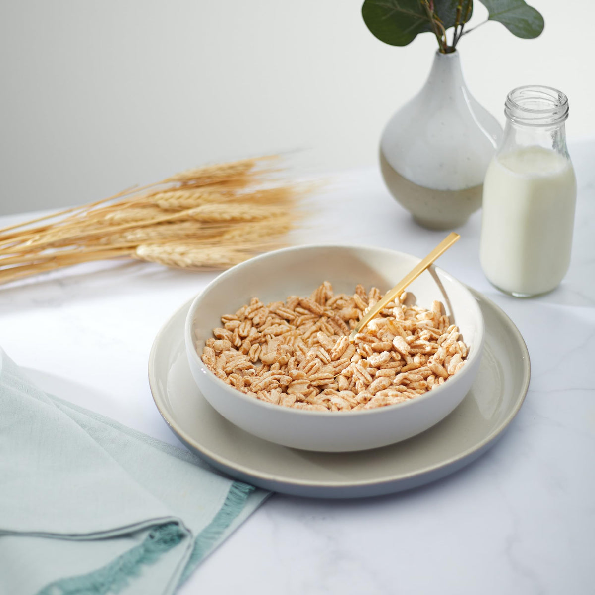 Nature's Path Kamut Puffs cereal closeup crunch emphasizes airy popped kernels and texture.