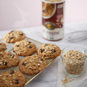 Nature's Path Oats packaging six canisters, practical pantry storage.