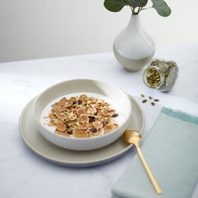 Nature's Path pumpkin seeds and raisins close-up emphasize organic ingredients.