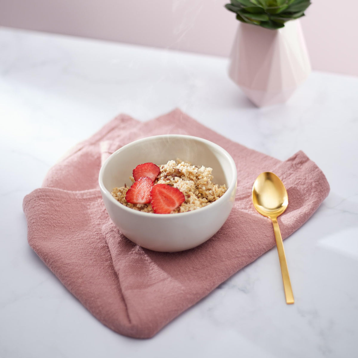 Nature's Path Whole grain oats in a bowl with spoon, ready to eat.