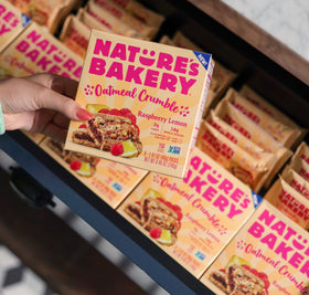 Nature's Bakery vegan and dairy-free badge on wrapper, plant-based snacking option.