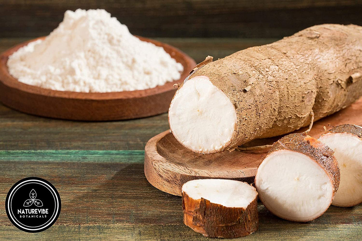 Cassava flour being scooped to measure for dough preparation with Naturevibe Botanicals.