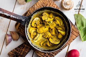 Garlic powder being added to a pan to boost aroma