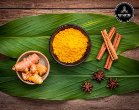 Naturevibe Botanicals turmeric powder texture close-up highlights fine grind.