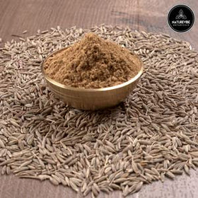 Naturevibe Botanicals cumin seed powder on a spoon boosts aroma in curries.