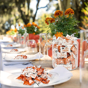 Naucoos graduation candy table display inviting guests to sample