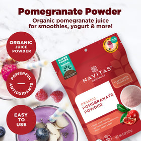 Navitas Organics Pomegranate Powder on a spoon, ideal for mixing into smoothies or dressings