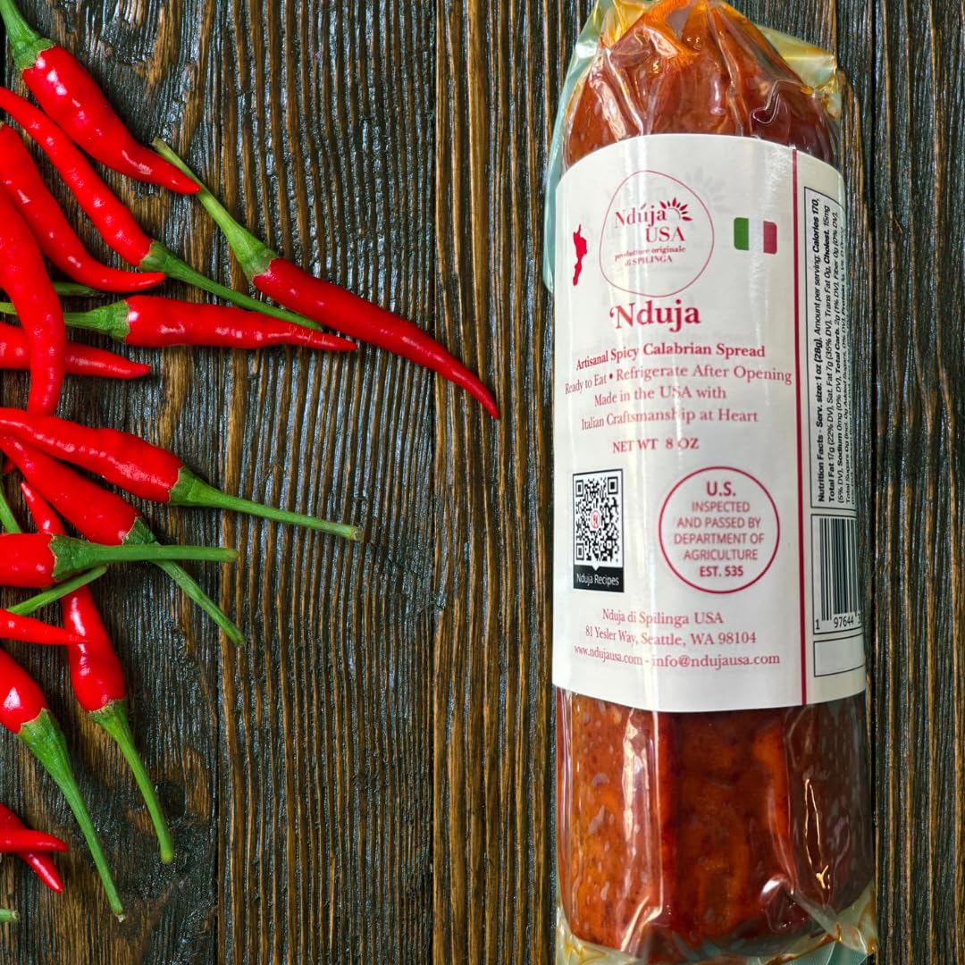 Nduja USA cylindrical pack ready to spread on crusty bread for bold flavor