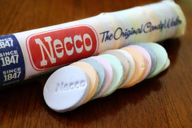 Close-up of Necco Wafers flavors, including chocolate and lemon.