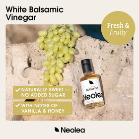 Neolea White Greek Balsamic pouring over a salad for bright tang
