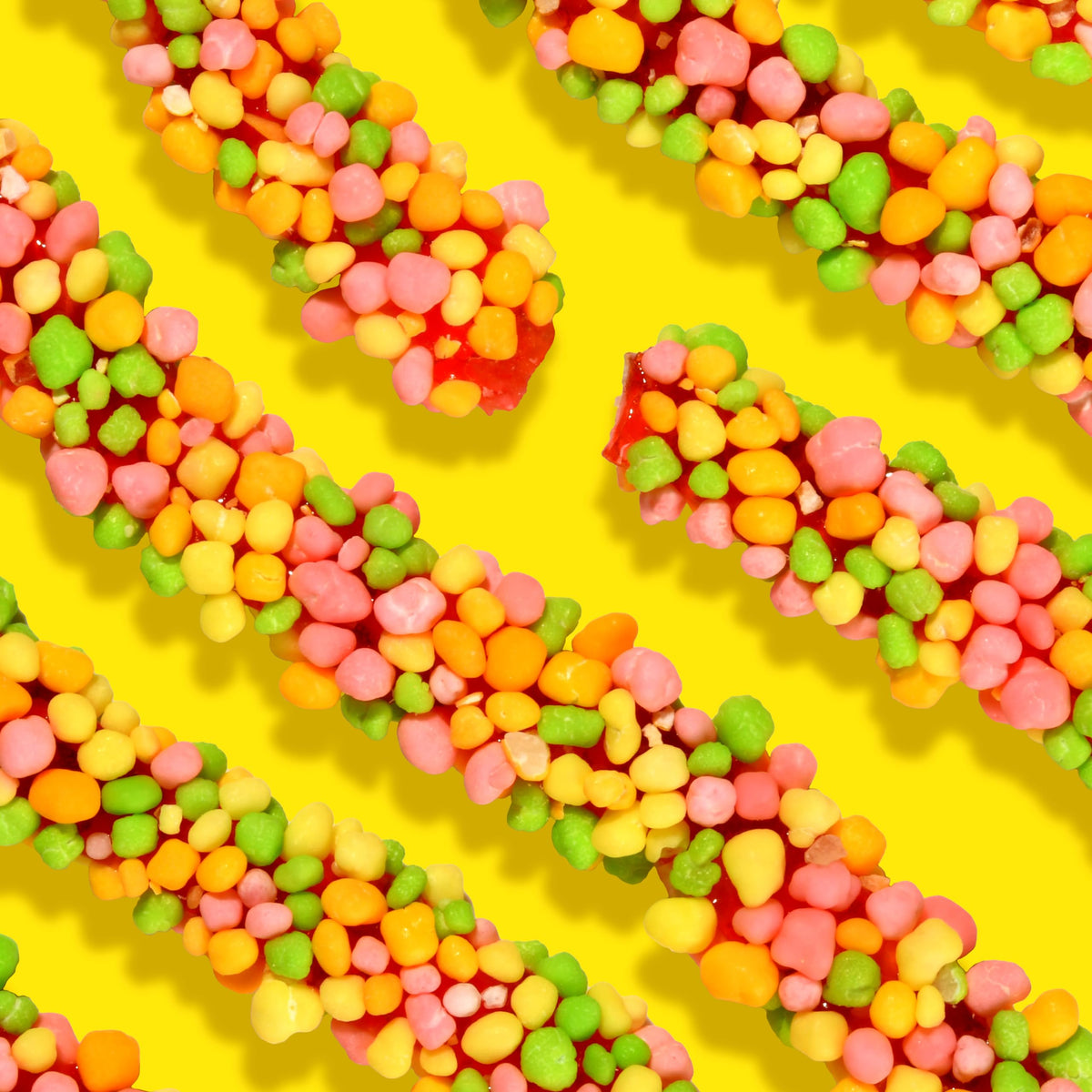 Texture contrast of Nerds Rope Tropical coating and chewy center for a playful snack.