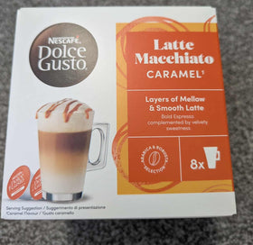 Nescafé Dolce Gusto caramel latte macchiato cup showing layered crema and caramel swirl.