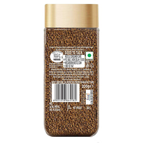 Nescafe Gold 200g whole beans close-up highlighting fresh grind aroma.