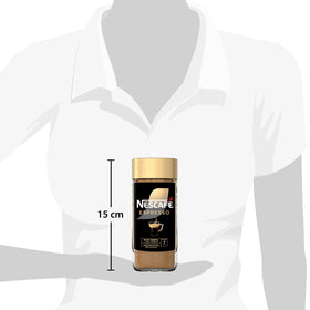 NESCAFÉ Gold Espresso with milk pour creates a creamy coffee moment.